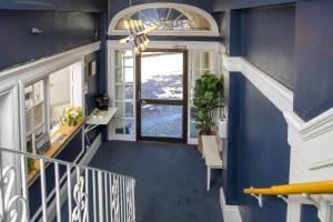 an overhead view of a hallway with a door and a window at Edwardian Hotel in San Francisco